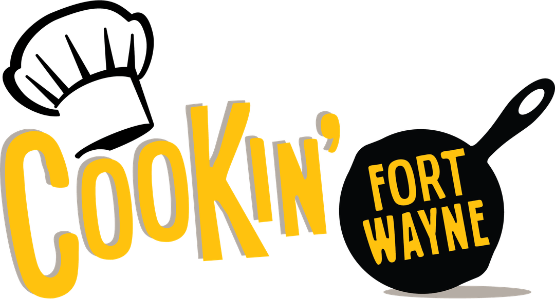 Cookin' Fort Wayne logo with a yellow wordmark, a chef's hat on the left, and a black skillet on the right.